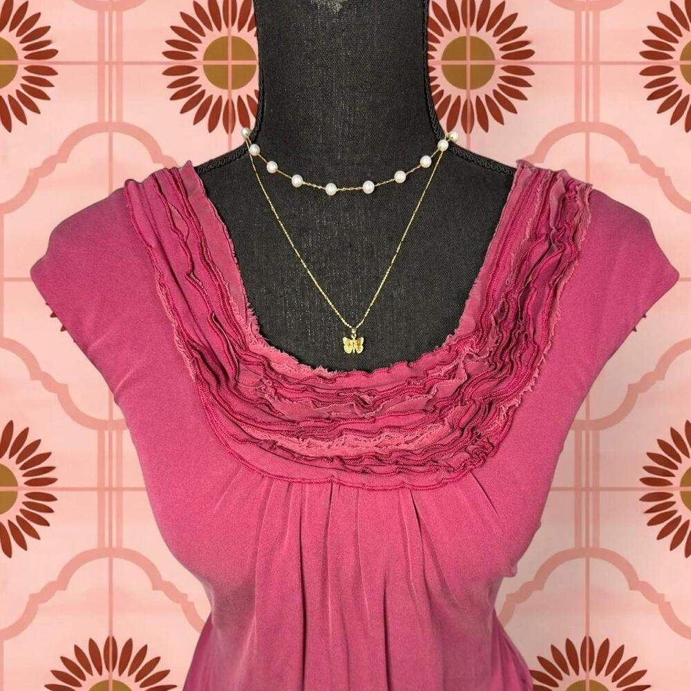 Pink ruffle top with a